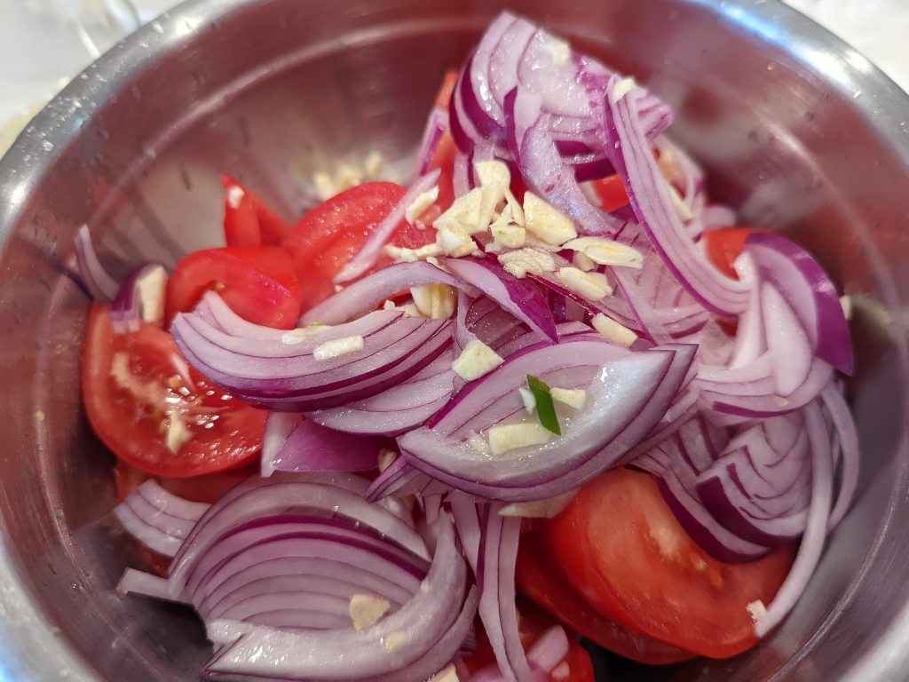 Green garden salad with corn, onions, jalapeños and tomatoes  